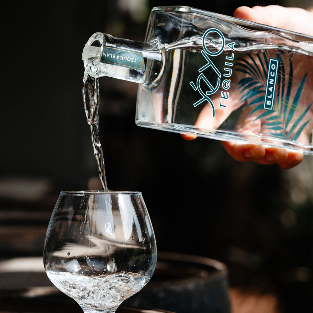 Yéyo Tequila Blanco being poured into a tasting glass