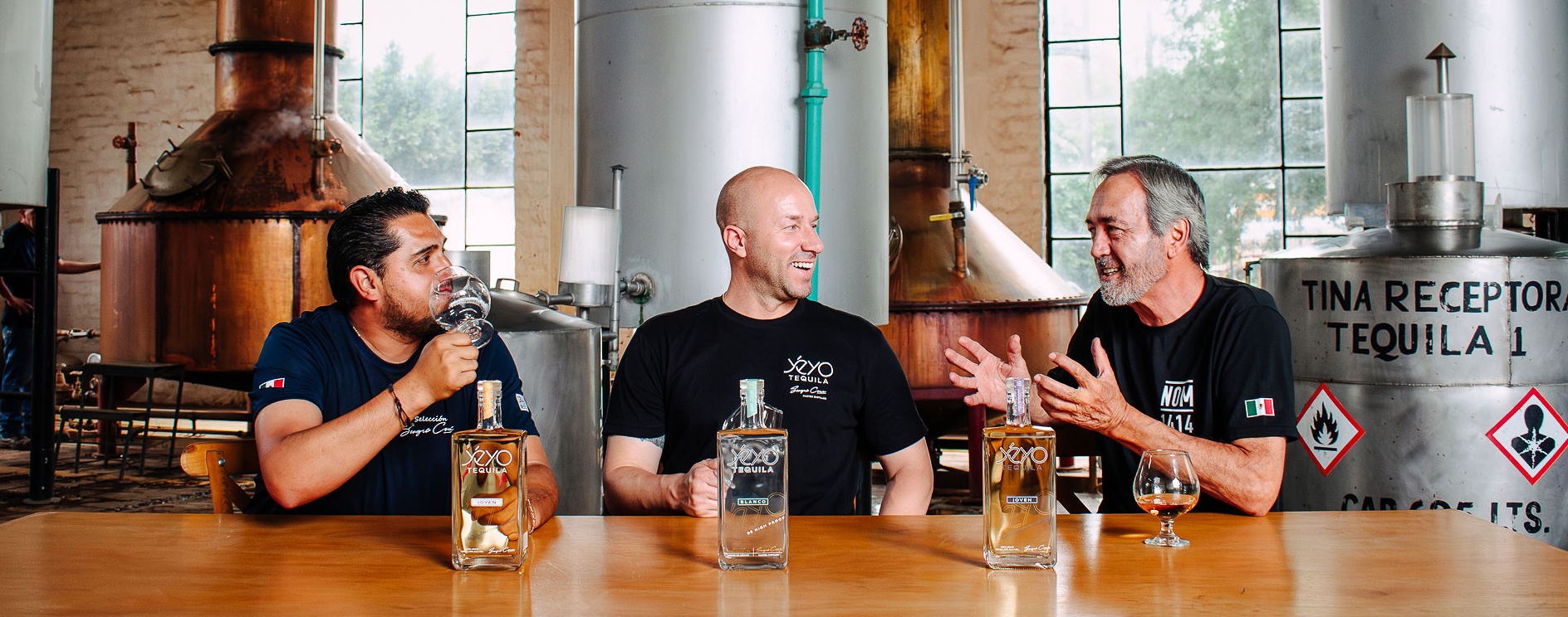 Sergio Cruz, Jon Bullinger and Sergio Vivanco tasting Yéyo together inside Destilería El Ranchito at NOM 1414 in Arandas