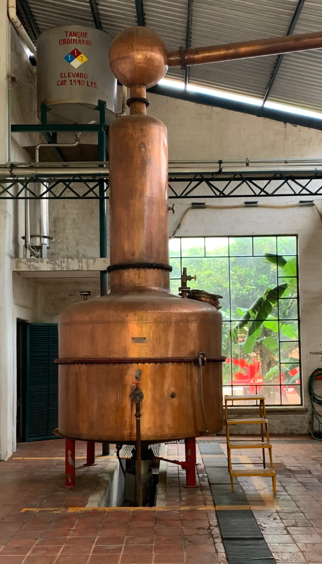The Destroyer, a tall copper pot still, inside Destilería El Ranchito, NOM 1414, in Arandas